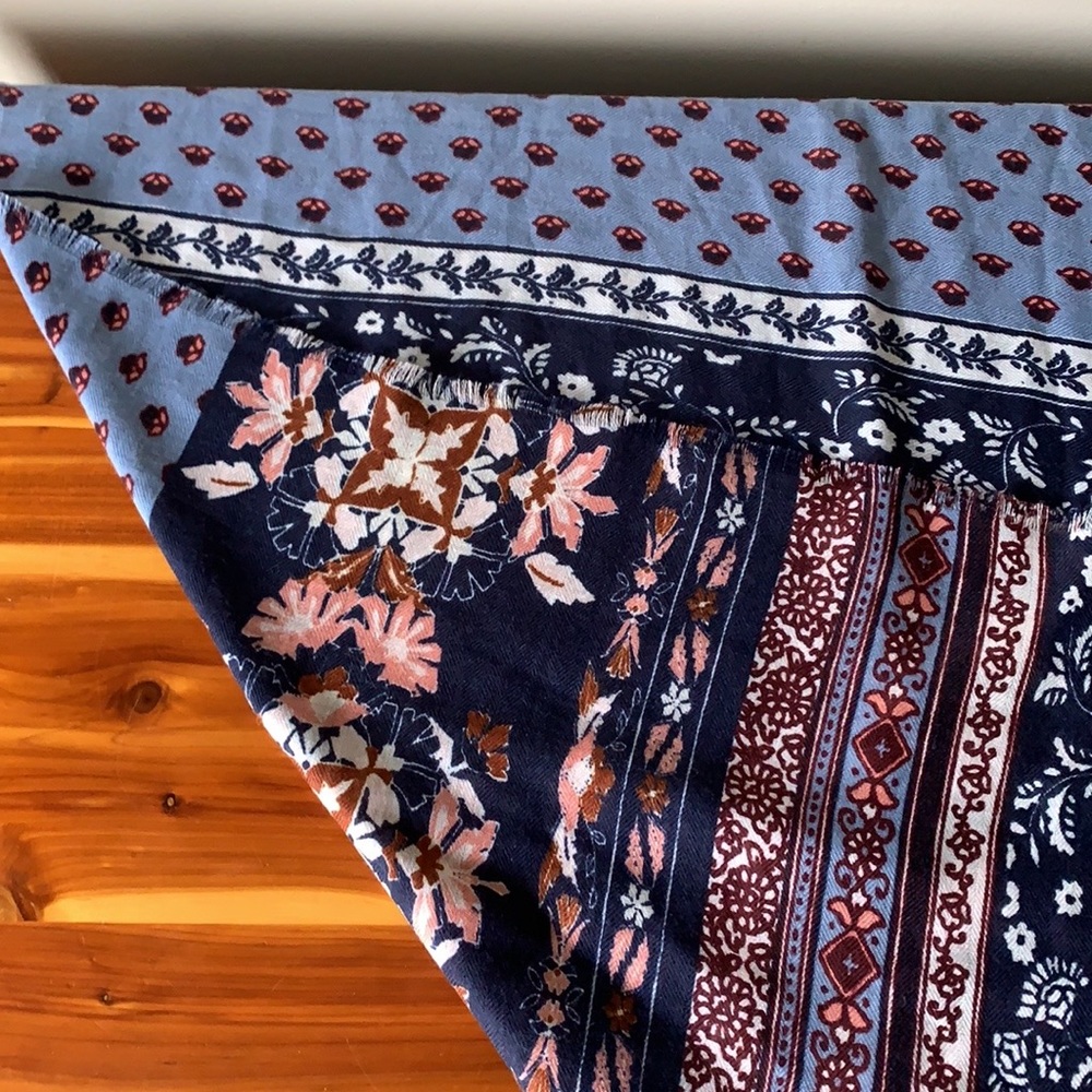 Printed scarf in shades of blue and pink.